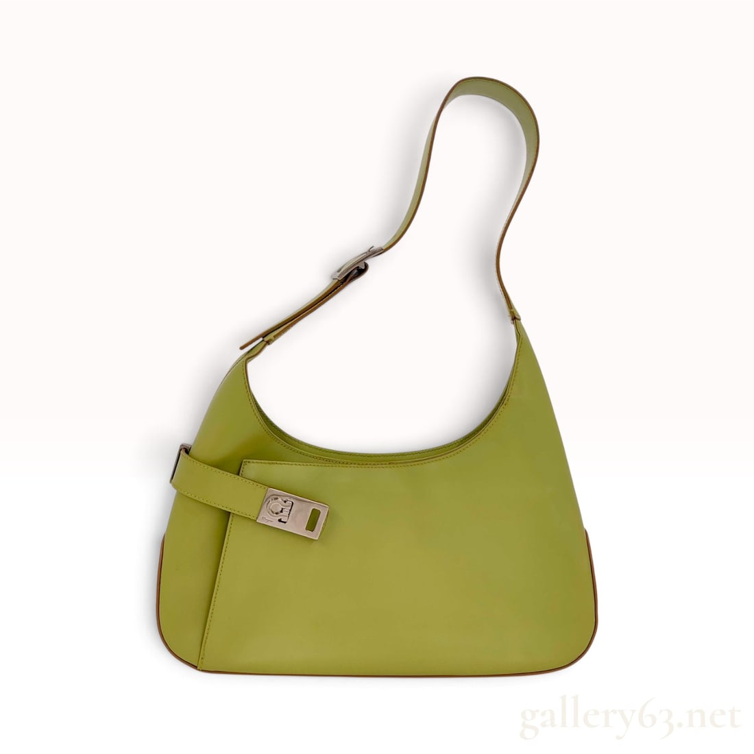 Salvatore Ferragamo Gancini Lime Green Leather Hobo Bag: This Salvatore Ferragamo hobo bag is crafted from smooth lime green leather. The exterior design features a single adjustable flat leather shoulder strap and a decorative horizontal strap at the base 