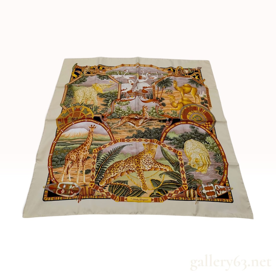 Vintage Salvatore Ferragamo African Safari Animals Cream Silk Scarf 90 cm with Box: This Salvatore Ferragamo silk carre 90 is crafted from cream-colored silk featuring a multi-vignette African safari theme. The intricate design depicts various wildlife including an elephant, flamingo