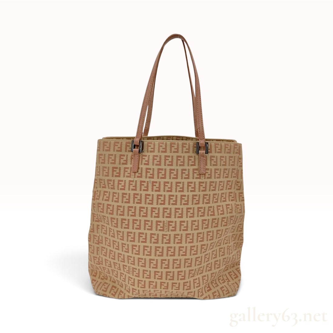 Vintage Fendi Zucchino Beige and Tobacco Canvas Tote Bag: This Fendi tote bag is crafted from Zucchino monogram canvas in a beige and tobacco colorway with tan leather trim. The exterior features the signature FF logo print throughout the body, accented by t