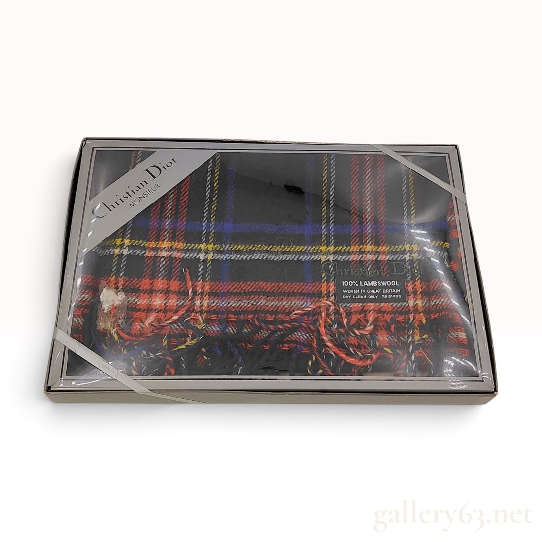 Vintage Christian Dior Monsieur Plaid Lambswool Scarf with Box: This Christian Dior Monsieur scarf is woven from 100% lambswool in a multi-color plaid pattern on a black ground, accented by intersecting lines of red, yellow, blue, and white. The garment features a