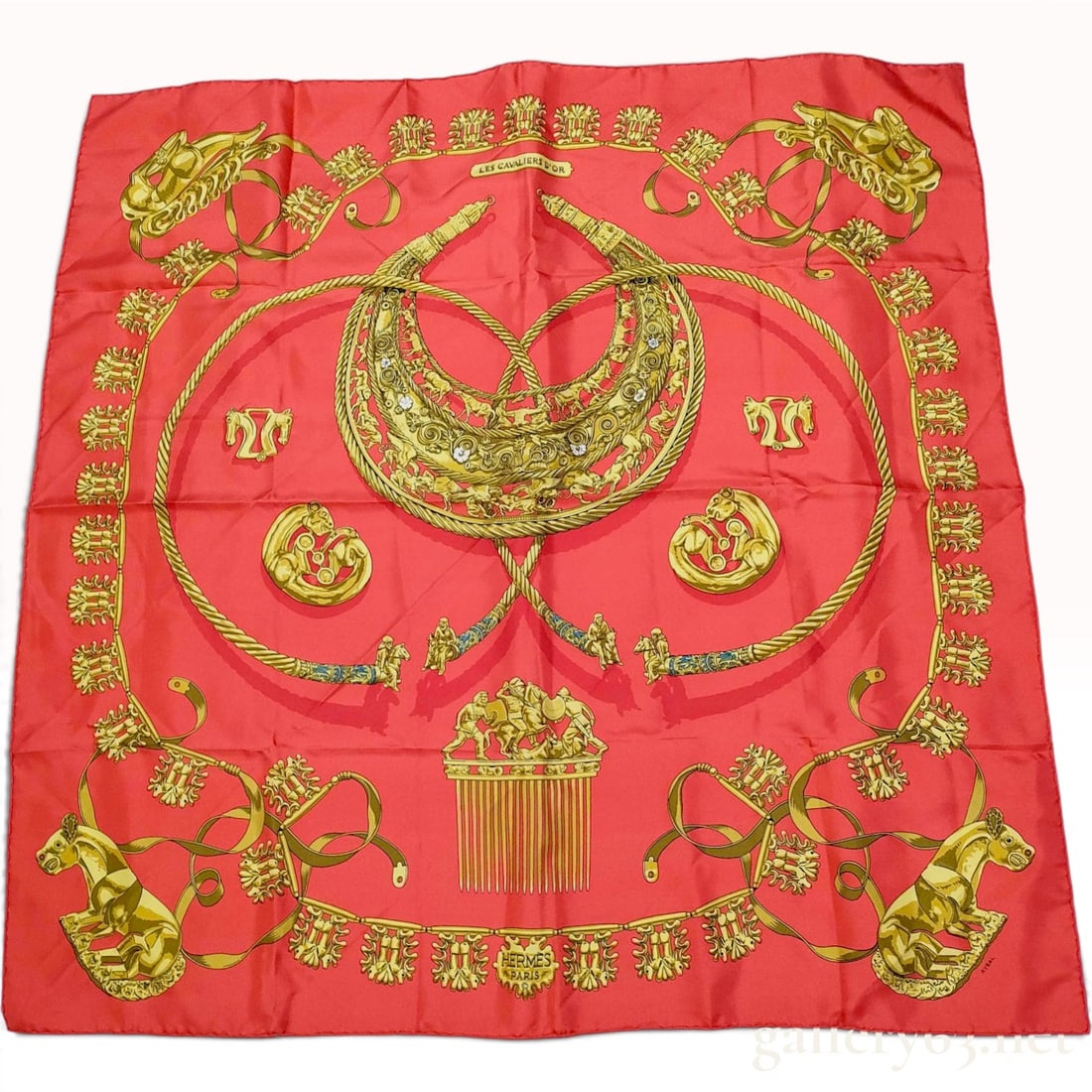 Vintage Hermes Les Cavaliers d'Or (The Golden Horsemen) Red and Gold Silk Carre 90: This Hermes silk carre 90 is crafted from heavyweight silk twill in the Les Cavaliers d'Or pattern designed by Vladimir Rybalchenko. The illustrations depict ancient Scythian gold artifacts, including