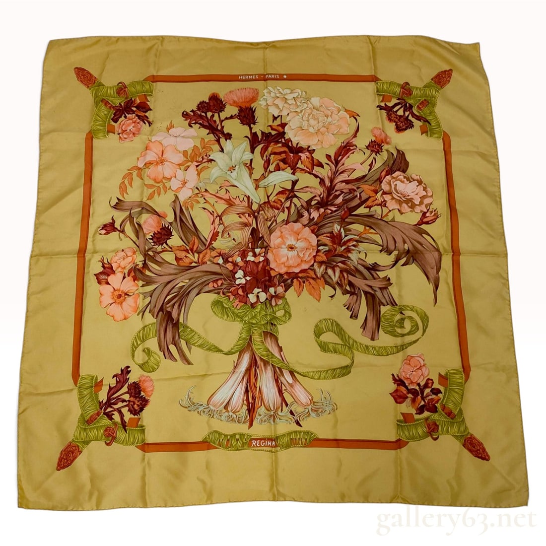 Vintage Hermes Regina Yellow Silk Carre 90: This Hermes silk carre 90 is decorated in the Regina floral pattern, a classic design featuring a large central bouquet. The composition includes white lilies, pink and white carnations, and reddish t