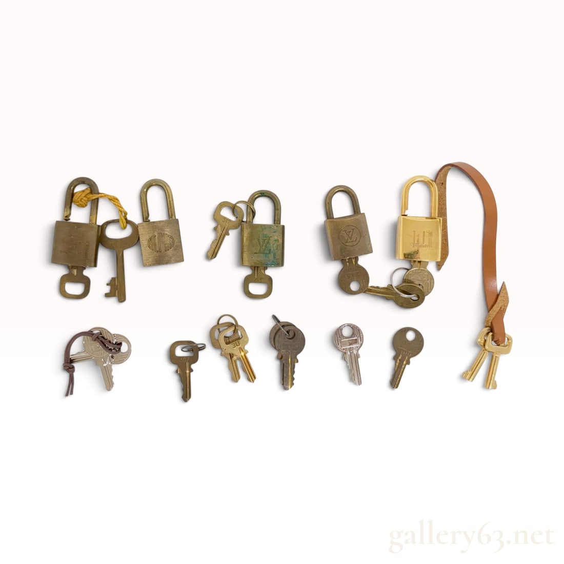 A Collection of Louis Vuitton Dunhill and Alpha Brass Padlocks and Keys (1 of 10)