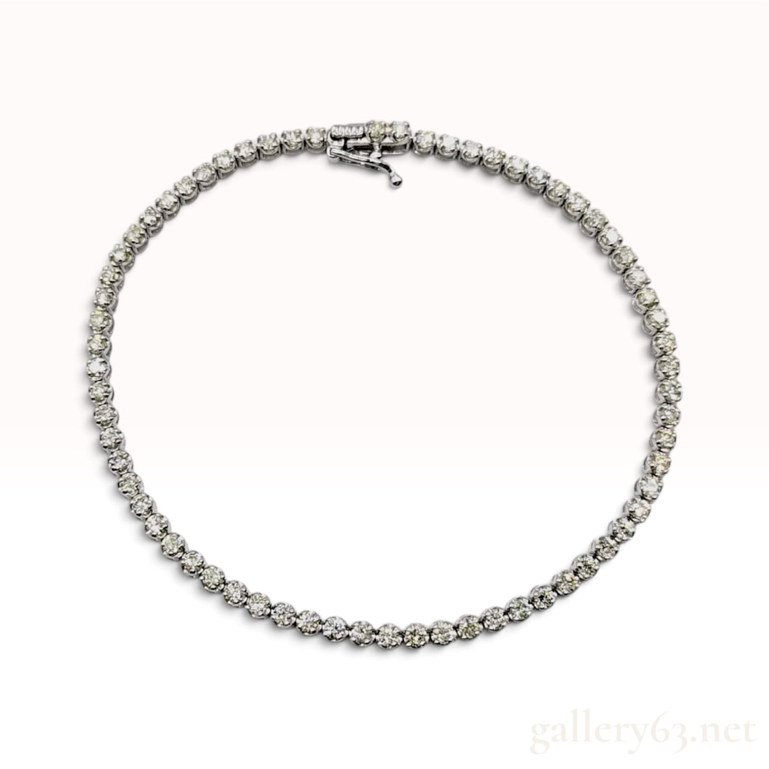2.00ctw Natural Diamond 18KWG Tennis Bracelet: This tennis bracelet is crafted from 18KWG and features a continuous line of 56 round brilliant-cut natural diamonds. Each gemstone is secured in a four-prong basket setting, with articulated links th