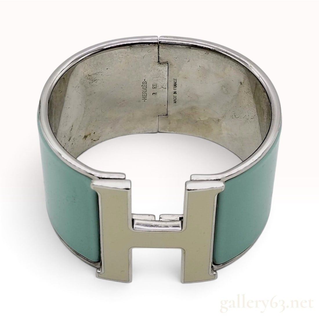 Hermes Clic Clac H Extra Wide Teal Enamel Palladium Plated Bracelet with Box: A Hermes Clic Clac H Extra Wide bracelet featuring teal enamel panels set within a palladium-plated metal cuff. The design is secured by a signature swivel H clasp and a rear hinge. The interior of th