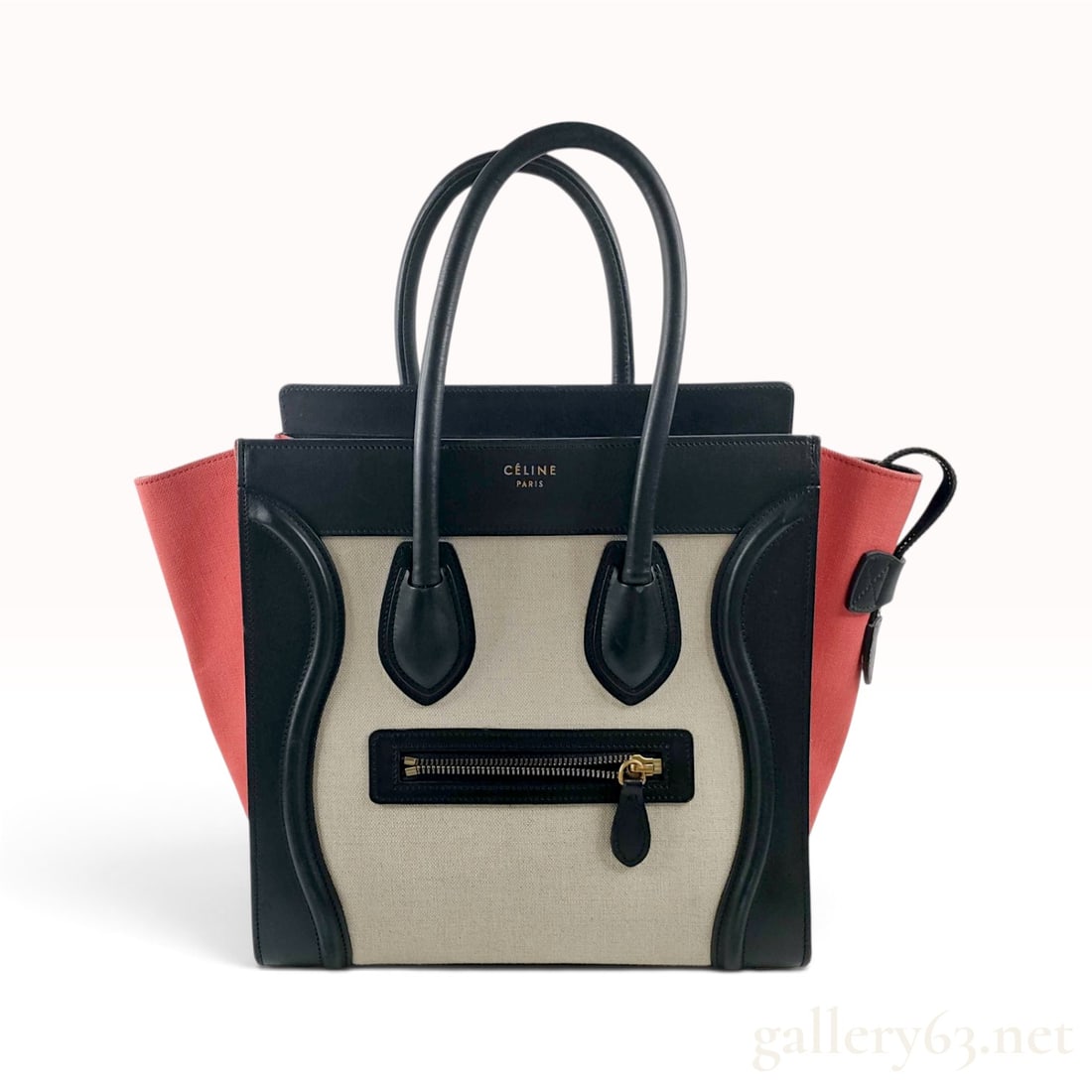 Celine Tricolor Leather and Canvas Micro Luggage Tote Bag: This Celine Micro Luggage Tote bag is crafted from a tricolor combination of smooth leather and durable canvas. The exterior features a smooth black leather frame, rolled top handles, and base, which 