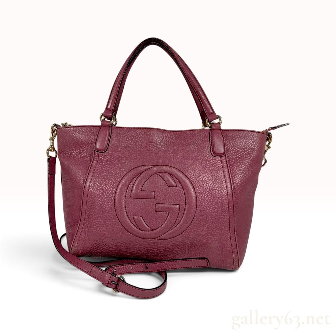 C. 2015 Gucci Soho Magenta Pebbled Leather Top Handle Bag: A Gucci Soho top handle bag crafted from supple magenta pebbled calfskin leather. This versatile tote features the iconic line's signature large embossed interlocking GG logo on the front face. The ba
