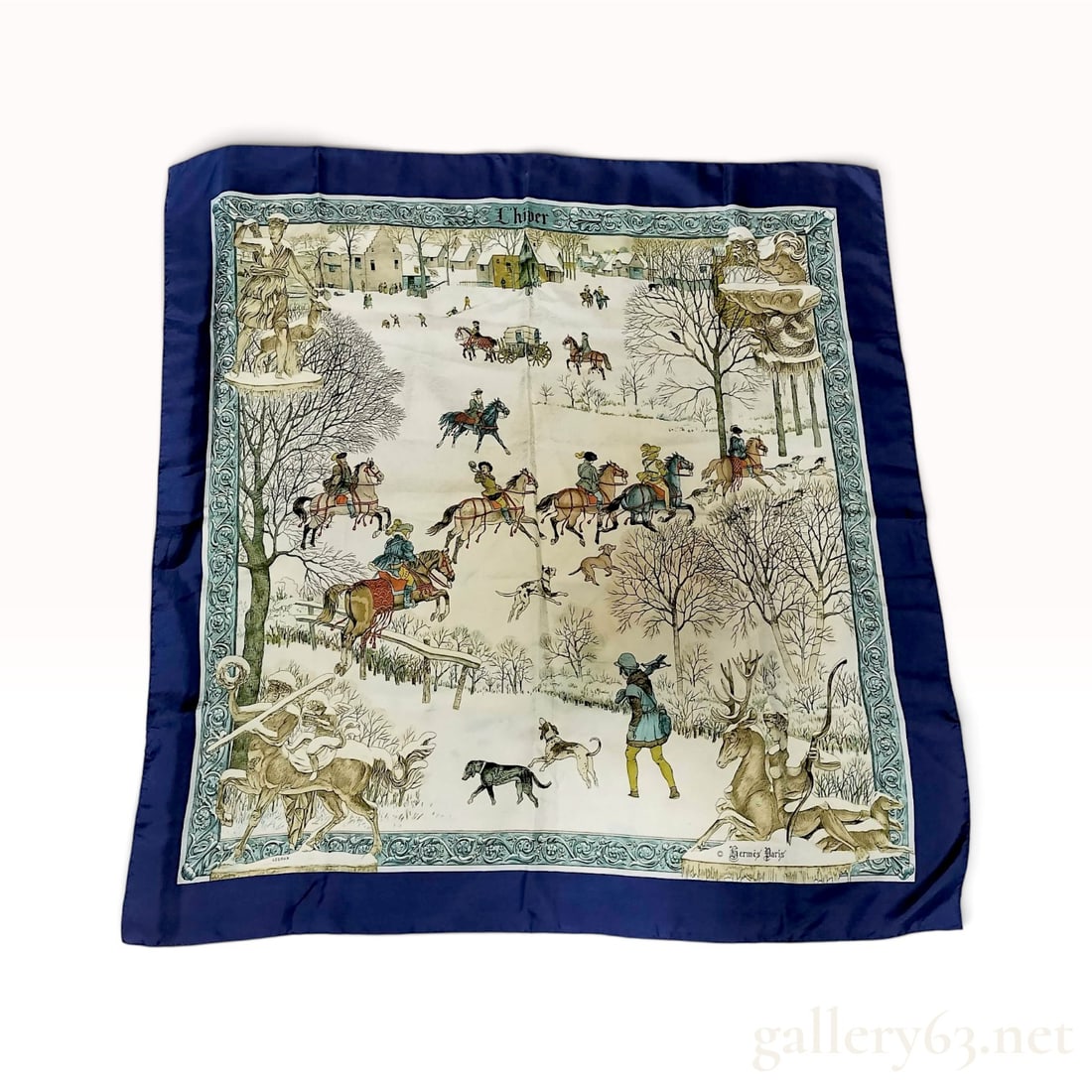 Vintage Hermes L'Hiver (Winter) Blue Silk Carre 90: This Hermes silk carre 90 crafted from silk twill features the L'Hiver pattern designed by Philippe Ledoux. The central composition depicts a snowy 18th-century village scene populated with equestrian