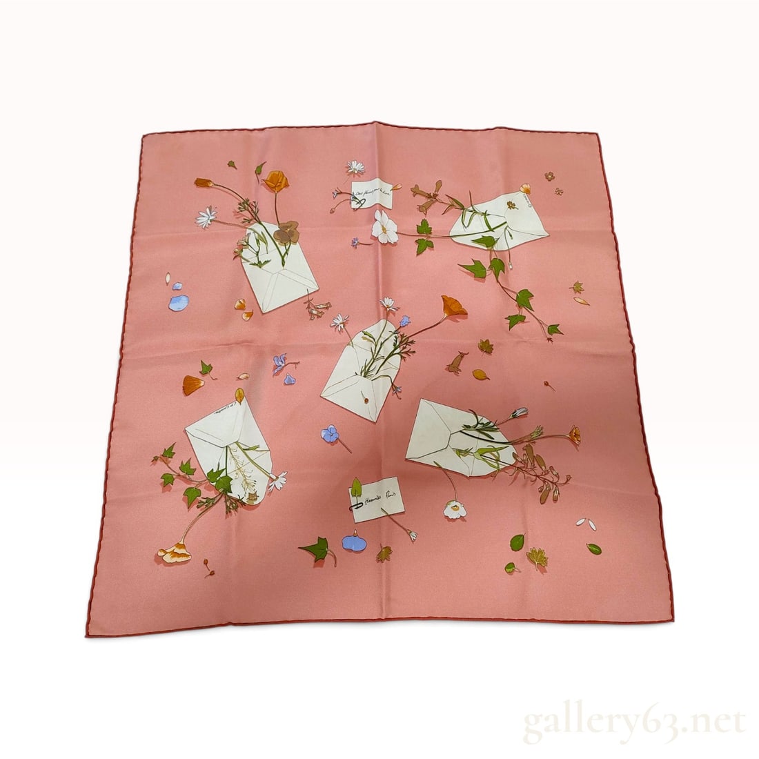 Hermes Des Fleurs Pour Le Dire Pink Silk Carre 45 with 2007 Collection Booklet: This Hermes silk carre 45 is crafted in the Des fleurs pour le dire (Flowers to Say It) pattern designed by artist C.P. Cooke. The motif features scattered white envelopes overflowing with various wil