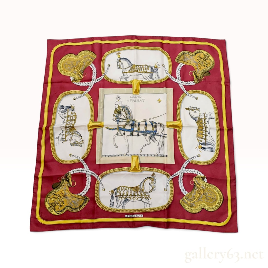 Vintage Hermes Grand Apparat Burgundy Silk Carre 90: This vintage Hermes silk carre 90 in the Grand Apparat pattern was designed by artist Jacques Eudel and first issued in 1962. The equestrian themed design features a deep burgundy red border and groun