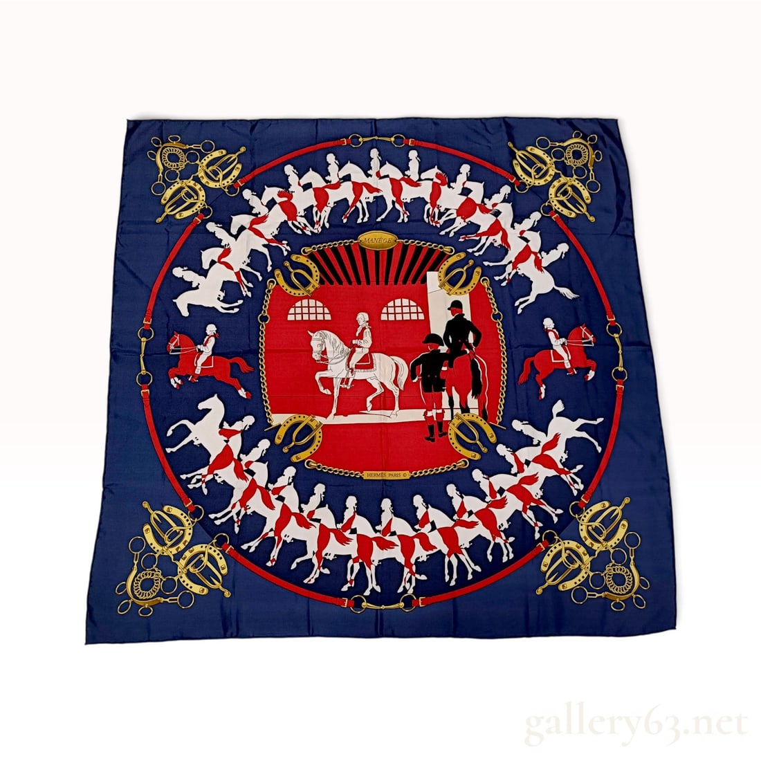 Vintage Hermes Manege Navy and Red Silk Carre 90: This vintage Hermes silk carre 90 crafted from silk twill features the Manege pattern designed by artist Philippe Ledoux. The design centers on a red circular medallion depicting an 18th-century dress