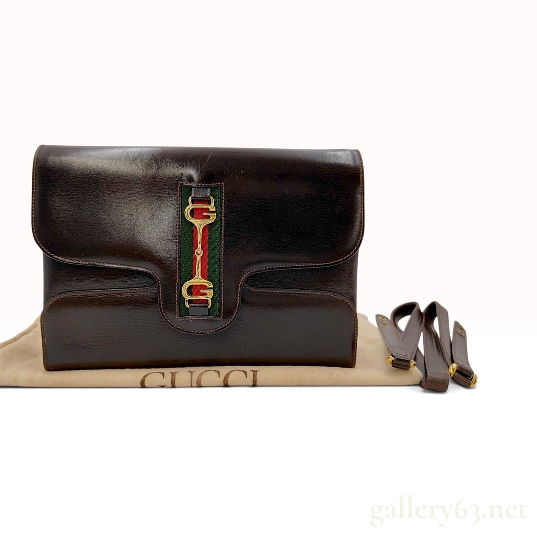 Vintage Gucci Web Horsebit Brown Leather Convertible Clutch Bag with Dust Bag: A vintage Gucci convertible clutch bag crafted from smooth dark brown leather featuring a central green and red textile web stripe. The front flap is accented with a gold-tone metal interlocking GG ho
