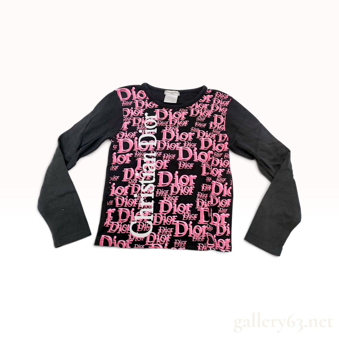 Vintage Christian Dior Logomania Black and Pink Cotton Long Sleeved T-Shirt USA 14: This Vintage Christian Dior long sleeved t-shirt is crafted from black cotton jersey with a distinctive logomania aesthetic. The front panel features a repeating Dior oblique pattern in varying shades