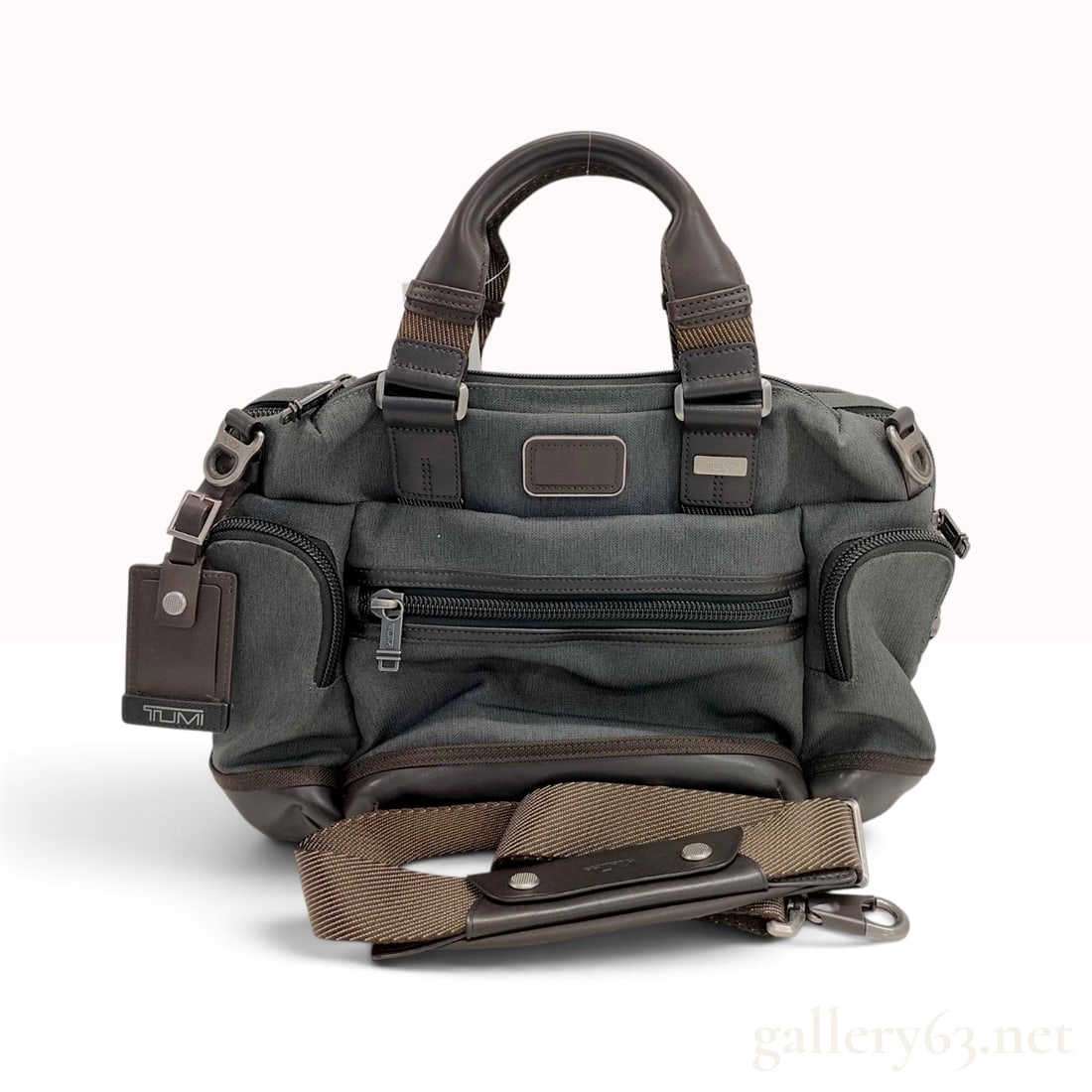 TUMI Alpha Bravo Brooks Slim Gray Leather-Trimmed Canvas Briefcase 16-Inch: This TUMI Alpha Bravo Brooks Slim briefcase is crafted from a heathered gray technical canvas with dark brown leather trim and gunmetal-toned hardware. The soft-sided design includes two front vertica