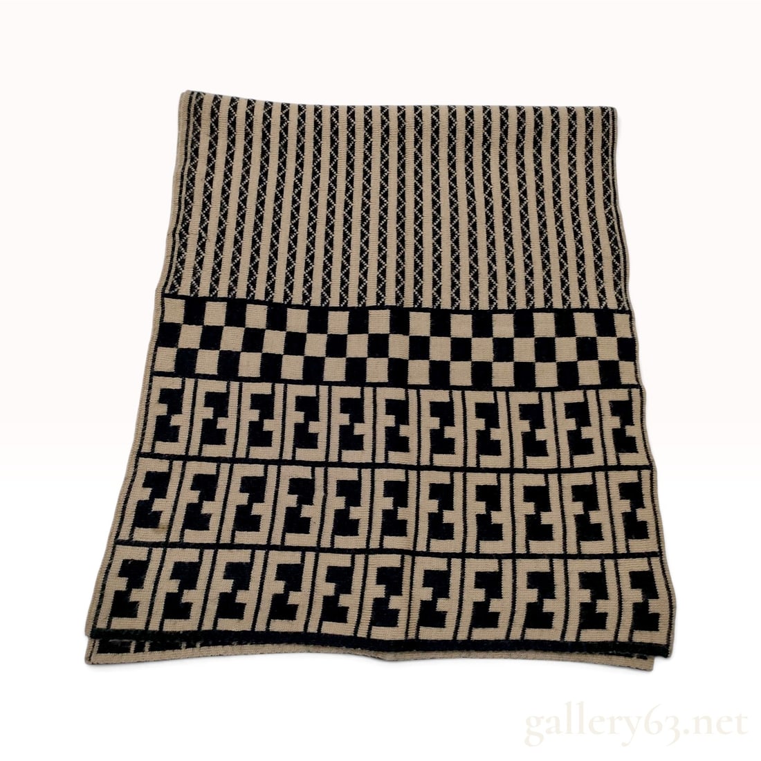 Vintage Fendi Monogram Tan and Black Wool Knit Scarf: This Fendi scarf is constructed from a wool knit featuring a layered multi-patterned design in tan and black. The central body of the scarf is decorated with horizontal stripes integrated with a repea