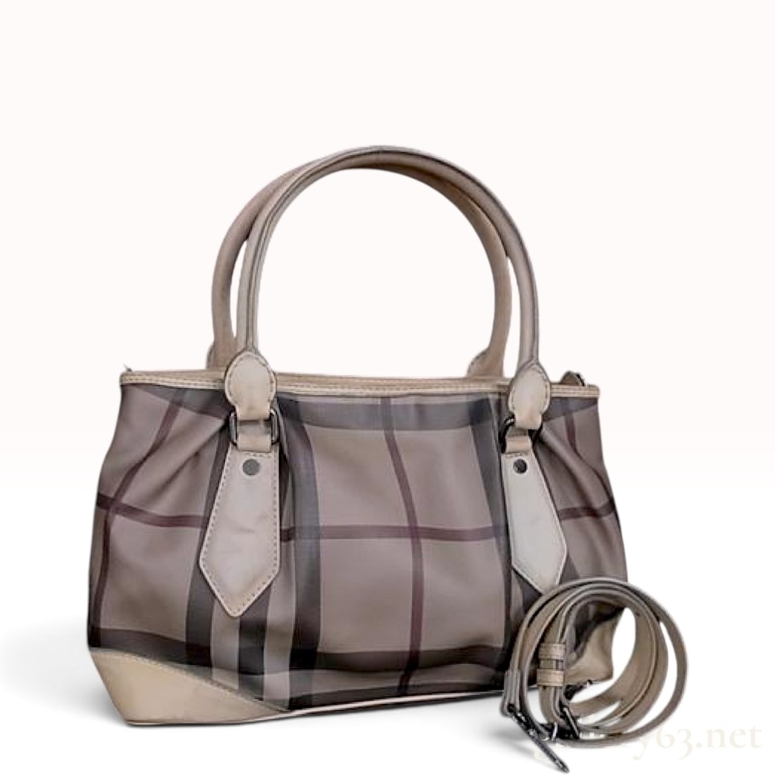 Burberry Smoked Check Pleated Beige Coated Canvas Tote Bag with Detachable Strap: This Burberry tote bag is constructed from smoked check coated canvas in shades of charcoal, taupe, and brown with beige leather trim. The bag features a pleated body design on the front and back, two