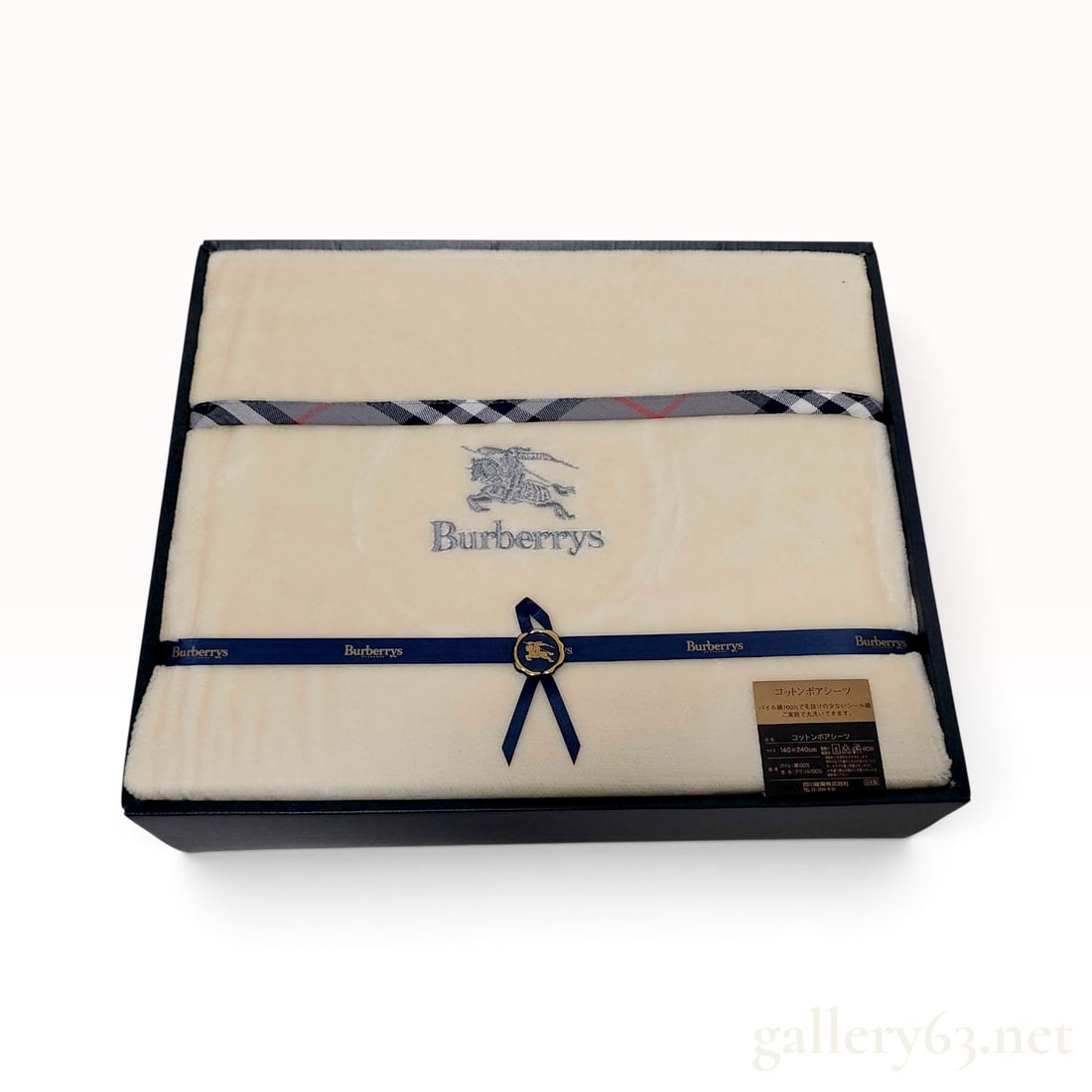 Vintage Burberrys Cotton Boa Sheet Cream with Box: A vintage Burberrys cotton boa sheet crafted with a 100% cotton pile on a 100% acrylic ground. The textile is cream in color and features a plush, soft pile texture. The design is centered by a silver