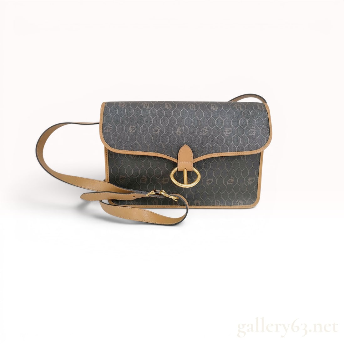 Christian Dior Honeycomb Monogram Shoulder Bag: Christian Dior shoulder bag in the signature Honeycomb monogram pattern, circa 1980s. Dark gray coated canvas body features a repeating script logo within a hexagonal grid, finished with tan leather t