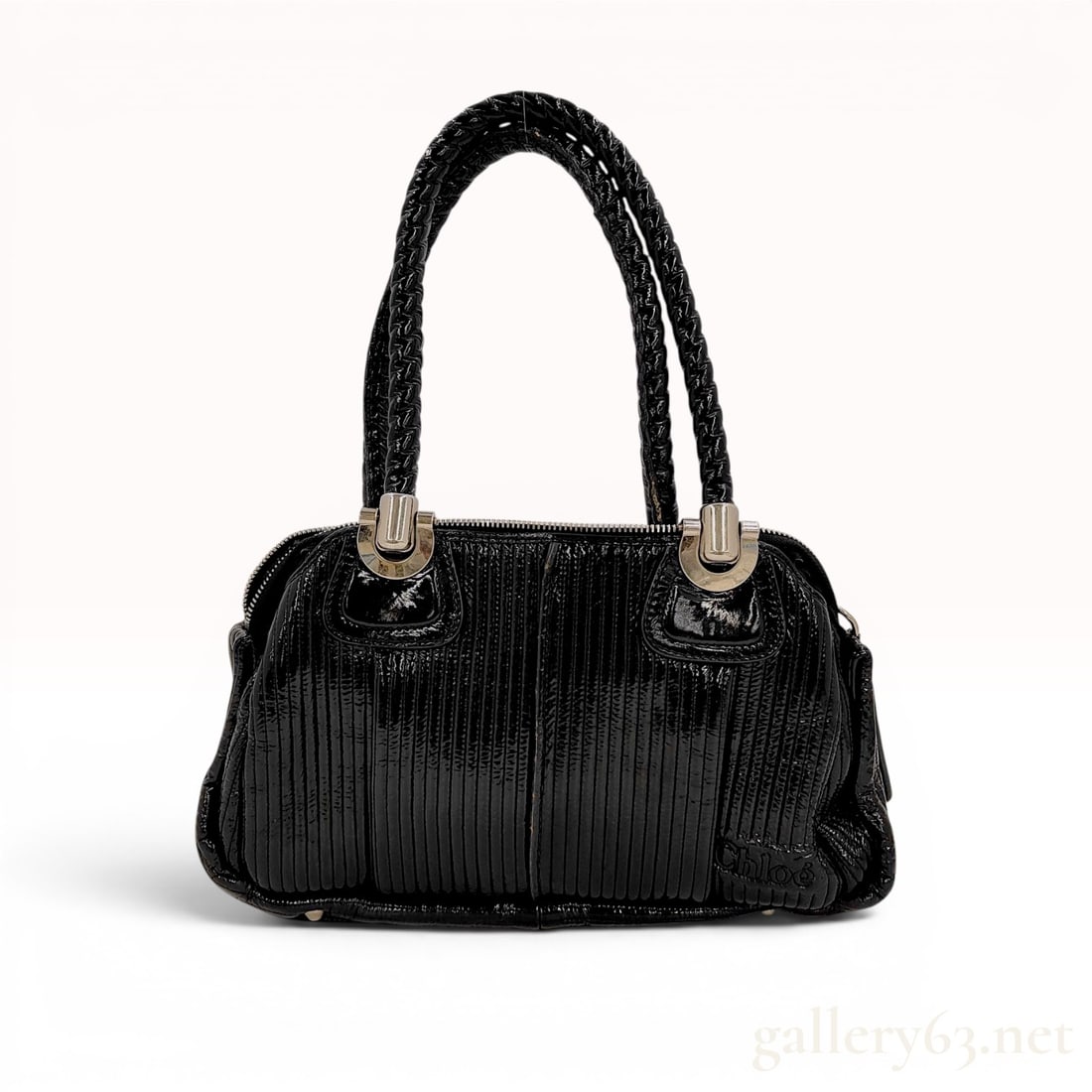 Chloe Black Pleated Patent Leather Heloise Satchel: Chloe black pleated patent leather Heloise satchel bag, circa mid-2000s. Features include double braided rolled handles, heavy silver-tone hardware, and a full-length zippered top closure. The bag is 