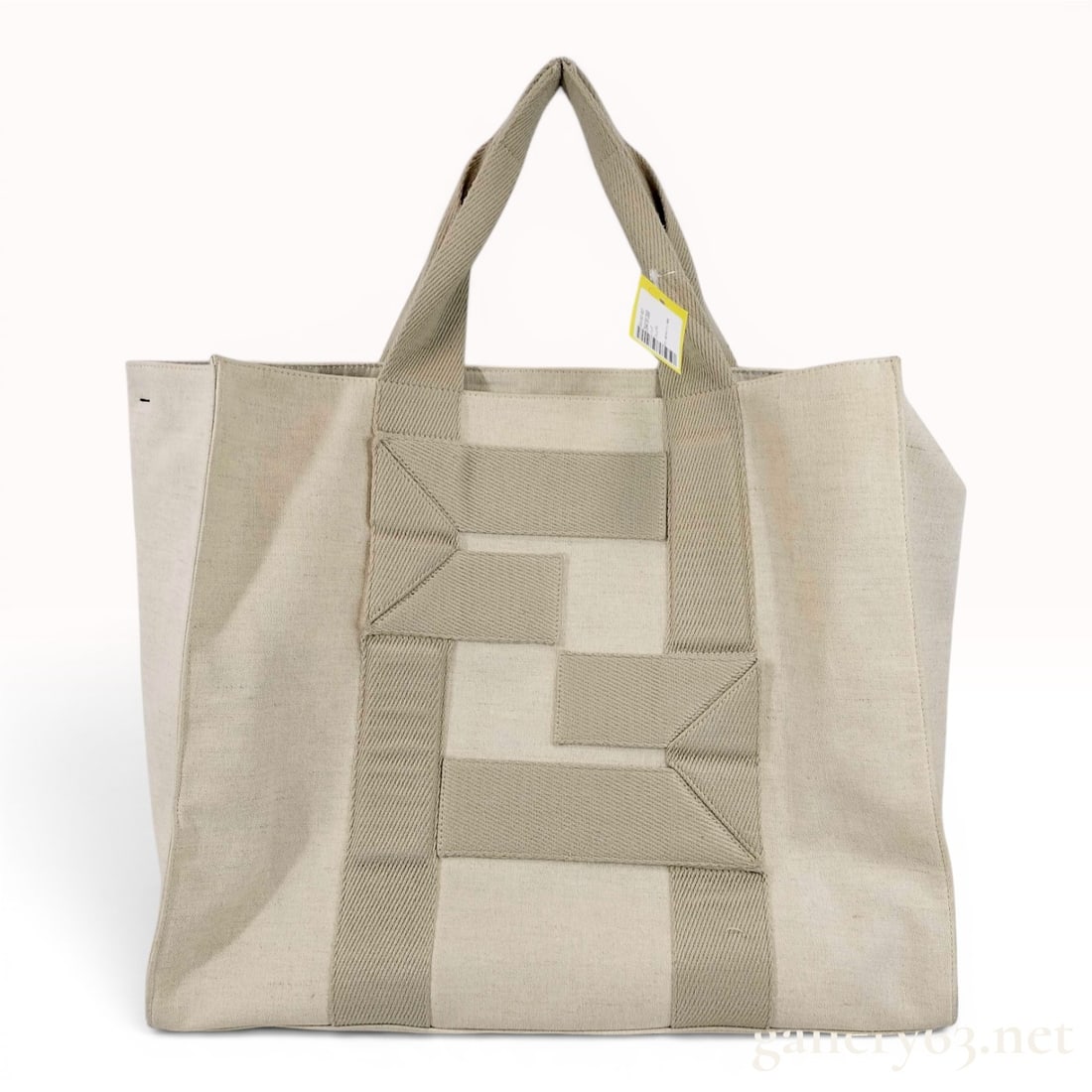 Fendi Large Canvas Logo Shopper Tote Bag: Fendi shopper tote bag featuring an off-white canvas body with beige woven webbing. The webbing top handles extend down the front and back of the bag to create a stylized logo motif. The bag is equipp