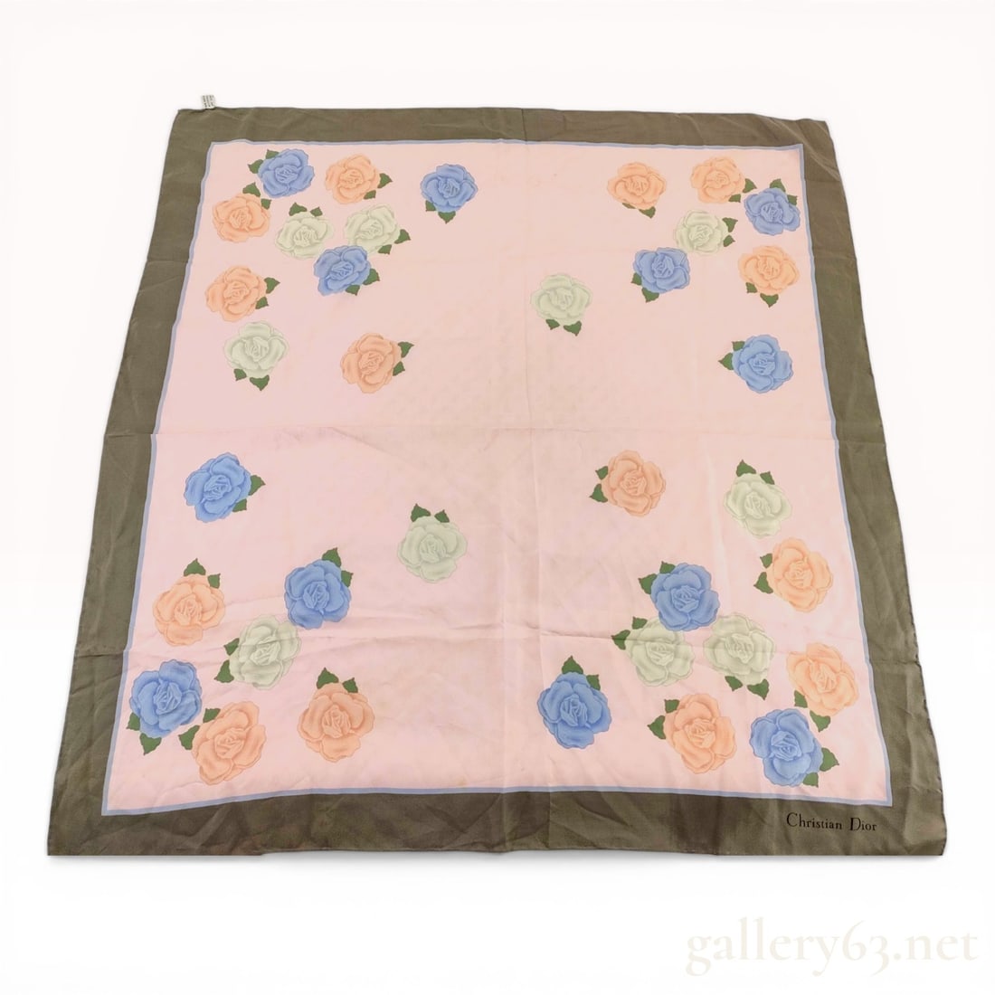 Christian Dior Floral Silk Square Scarf with CD Jacquard Pattern: Christian Dior floral square silk scarf, circa 1980s. The scarf features a pale pink ground with a tone-on-tone CD logo jacquard weave and a scattered rose pattern in peach, dusty blue, and celadon gr