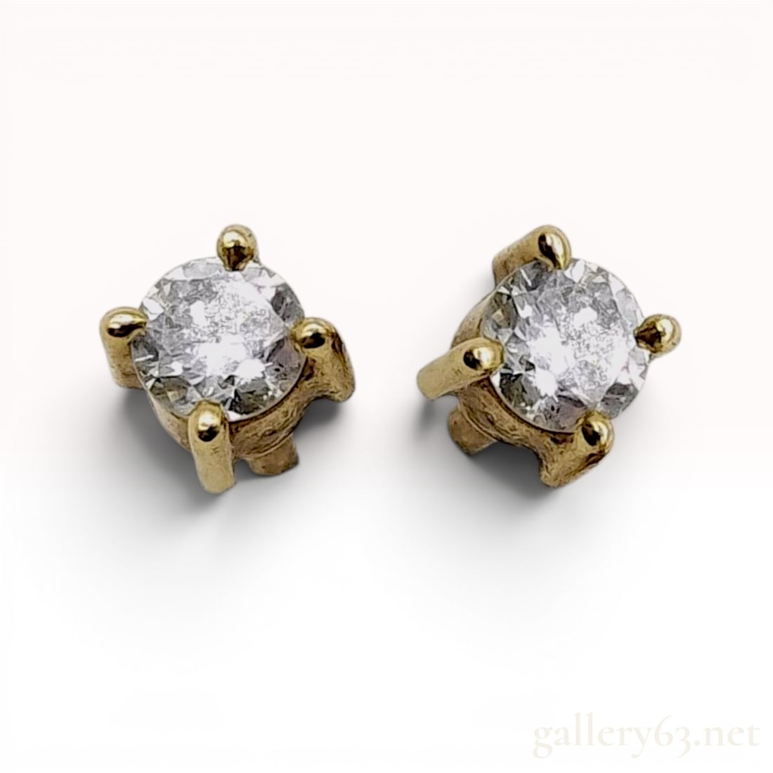 A Pair of Diamond Stud Earrings in 14 Karat Yellow Gold (1 of 7)