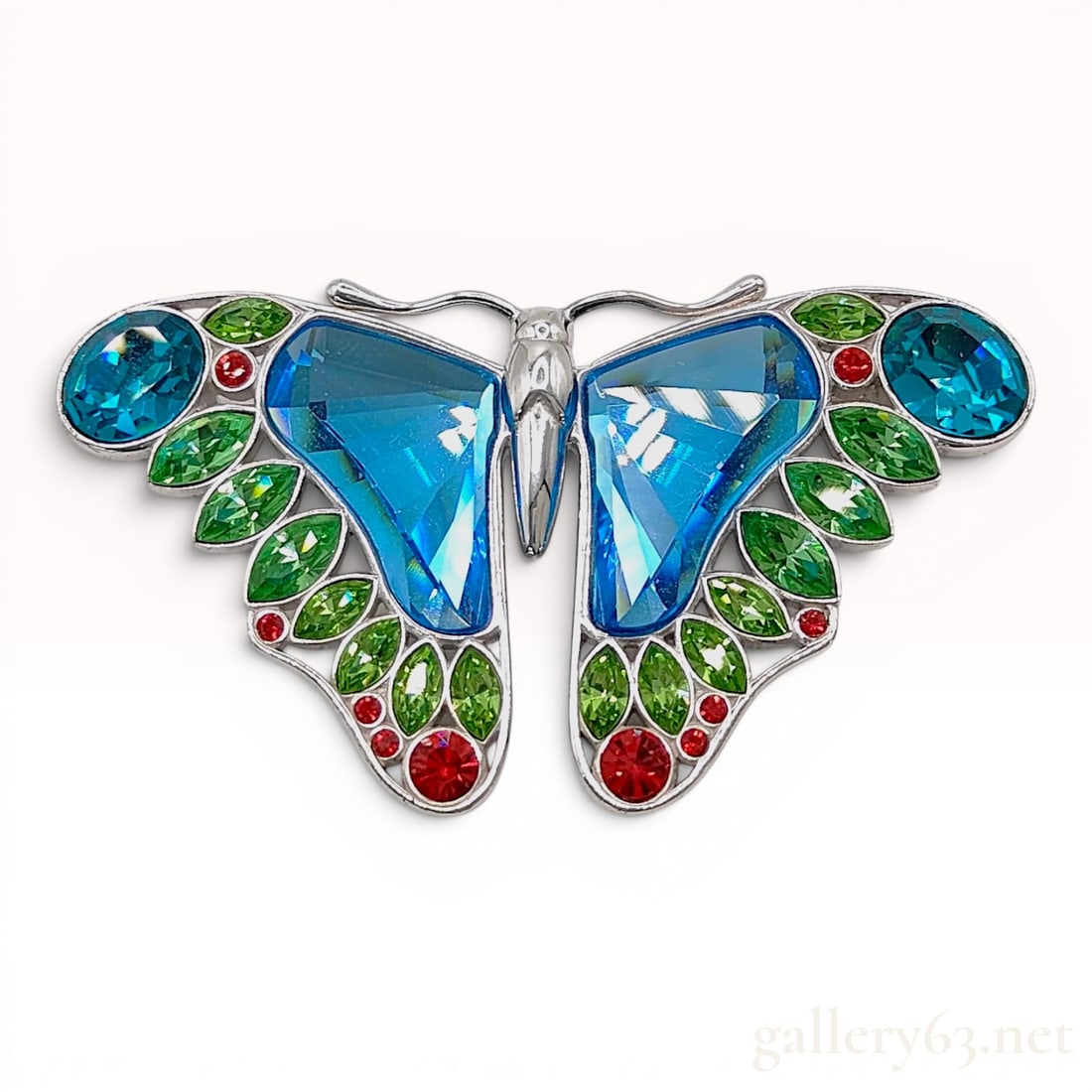 Swarovski Almazora Paradise Sterling Silver and Crystal Butterfly Brooch: This Swarovski butterfly brooch is from the Paradise collection, specifically the Almazora model. The piece is constructed from 925 sterling silver and features articulated wings. The upper wing secti