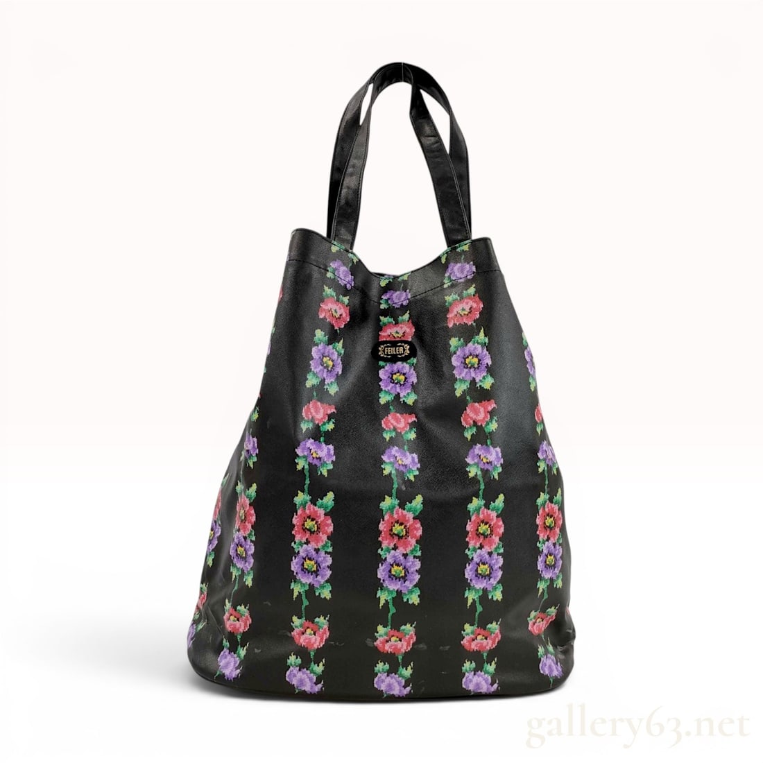 Feiler Germany Black Coated Canvas Floral Stripe Tote Bag: A large tote bag by the German brand Feiler, featuring a signature vertical floral stripe pattern. The bag is crafted from black coated canvas with a textured cross-hatch grain. The exterior decoratio
