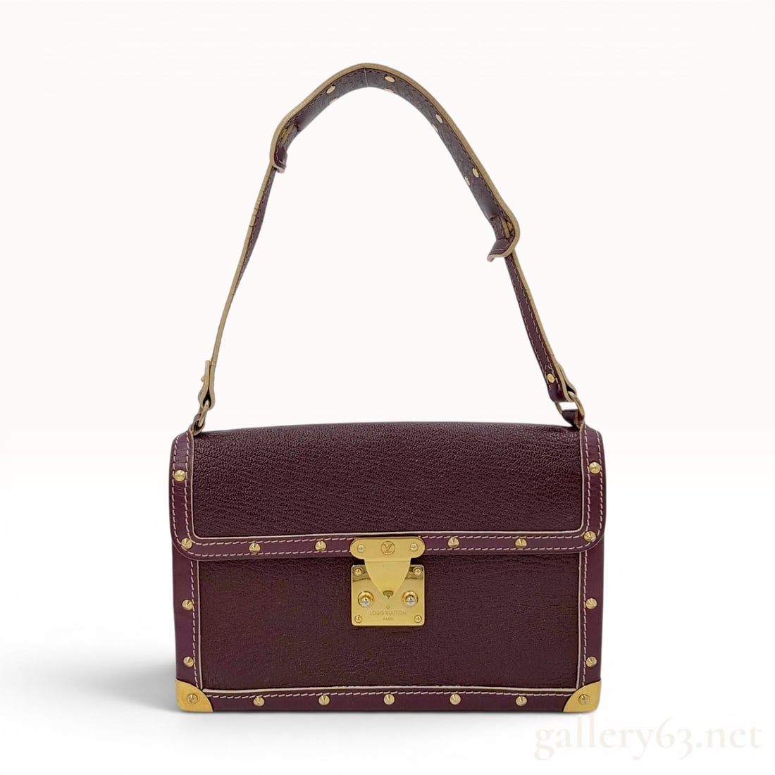 Louis Vuitton Plum Suhali Leather Le Talentueux Shoulder Bag: A structured Louis Vuitton Le Talentueux shoulder bag from the Suhali leather collection. The rectangular body is crafted from plum-toned goatskin leather featuring a distinctive grainy texture, accen