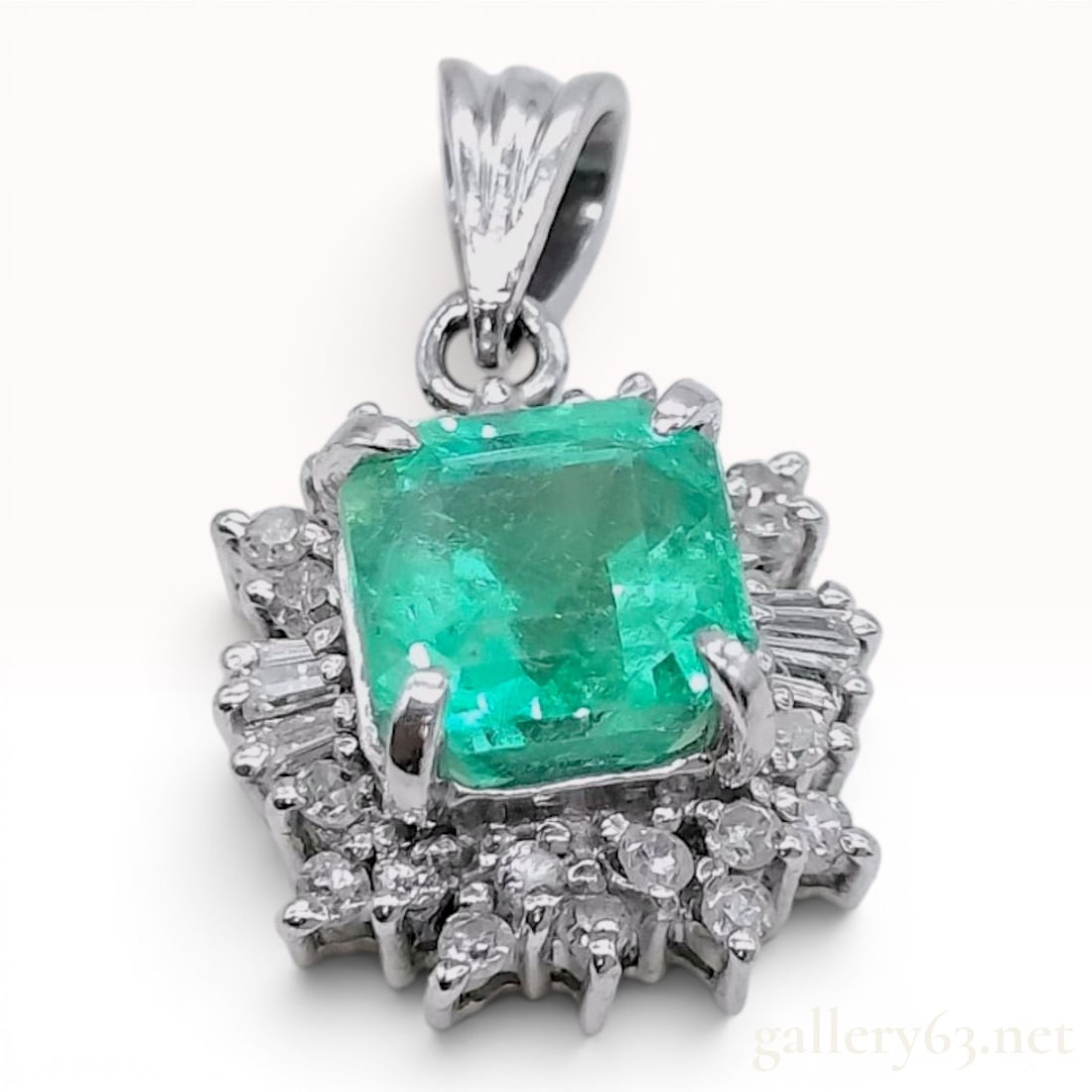 Platinum 1.22ct Emerald and.20ctw Diamond Halo Pendant: This pendant features a central emerald-cut green emerald, approximately 1.22 carats, set in a four-prong platinum mount. The emerald exhibits visible natural inclusions and is surrounded by a halo of