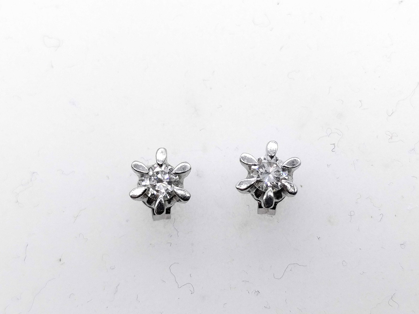 A Pair of Diamond and Platinum Flower Style Stud Earrings (1 of 7)