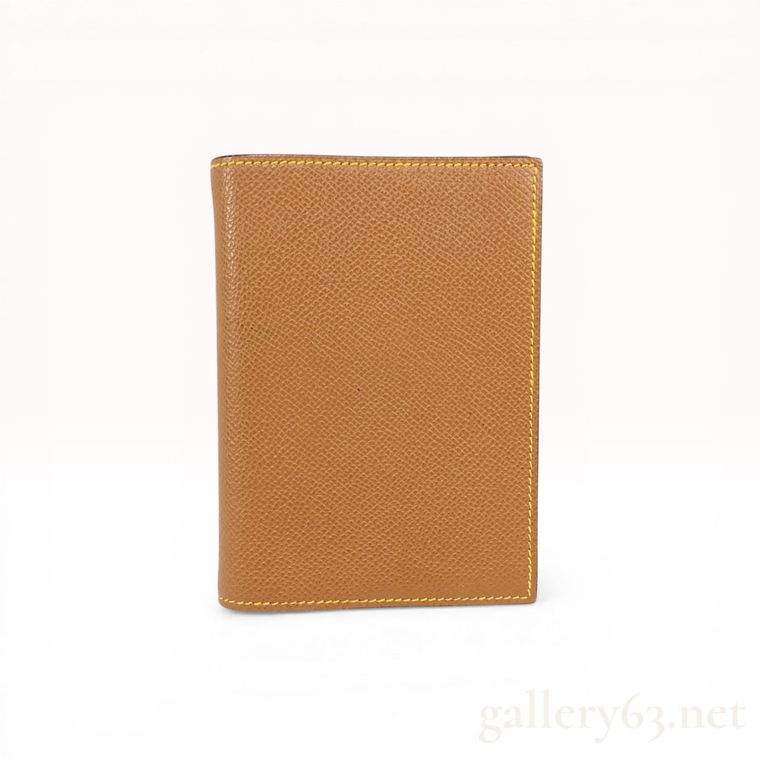 Hermes Vision II Simple Agenda Cover in Gold Epsom Leather: Hermes Vision II Simple agenda cover, contemporary. Bi-color Epsom leather construction featuring a tan exterior and yellow interior with two side slip pockets. Features two silver-tone metal hooks on