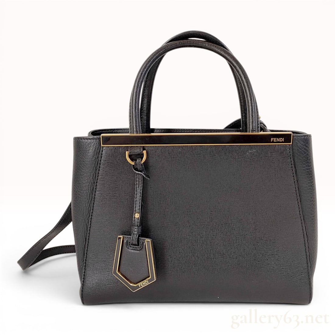 Fendi Petite 2Jours Black Vitello Elite Leather Tote Bag: This Fendi Petite 2Jours tote bag is crafted from black cross-hatched Vitello Elite leather with tonal pebbled leather side gussets and gold-tone hardware. The structured design features two rolled to