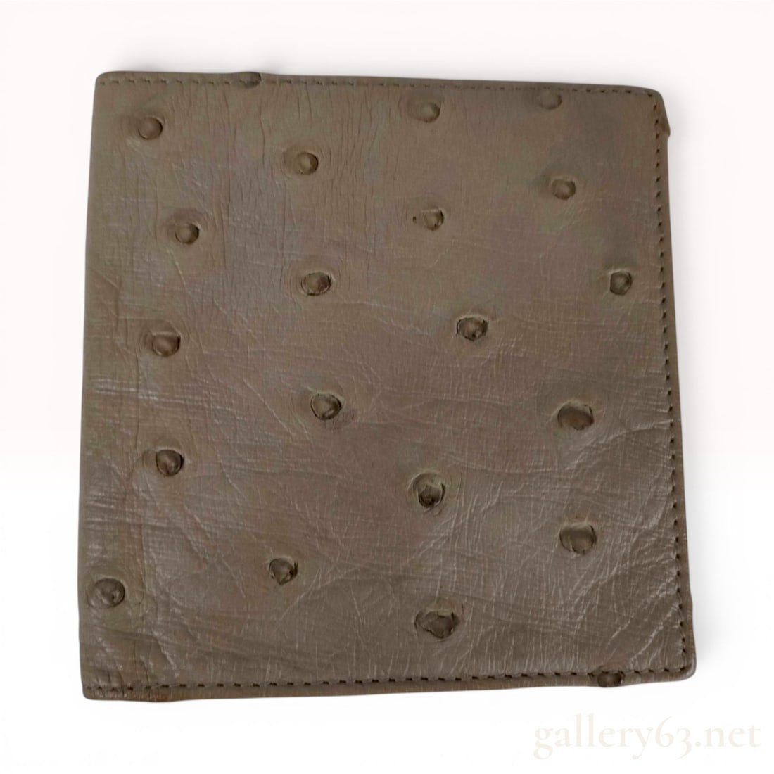 Loewe Ostrich Leather Bifold Wallet: A Loewe bifold wallet featuring a taupe ostrich leather exterior and a smooth black leather interior. The exterior displays the natural raised quill-mark texture characteristic of authentic ostrich sk