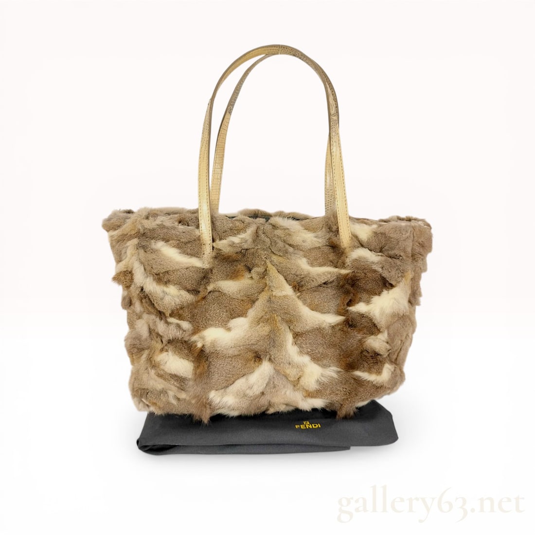 Fendi Pieced Fur Tote Bag with Lizard Leather Handles: Fendi shoulder bag featuring a pieced fur exterior in variegated earth tones including brown, beige, and cream. The construction includes dual lizard-embossed leather handles, gunmetal-tone hardware w