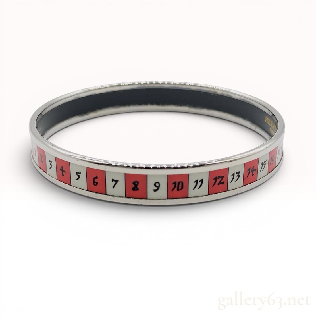 Hermes Astrologie Libra Narrow Enamel Bangle Bracelet with Box: This Hermes narrow bangle bracelet features the Astrologie motif, specifically highlighting the Libra zodiac sign. The bracelet is constructed from silver-toned metal with a recessed enamel inlay. The