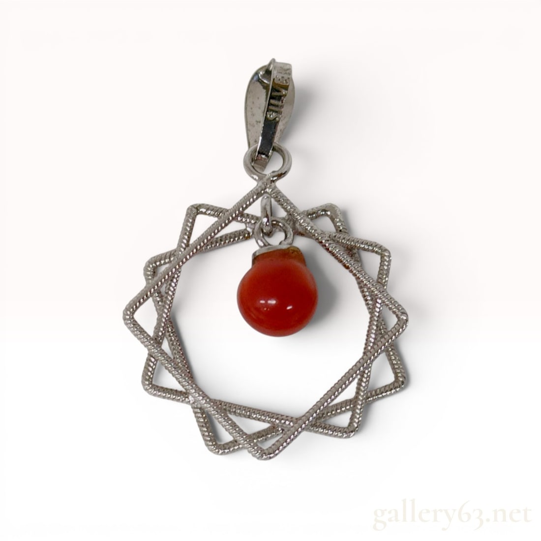Silver and Antique Red Coral Geometric Star Pendant Top: Silver and antique red coral pendant top featuring a geometric eight-pointed star motif. The frame is constructed from overlapping squares of textured, coiled metal with a single spherical red coral b