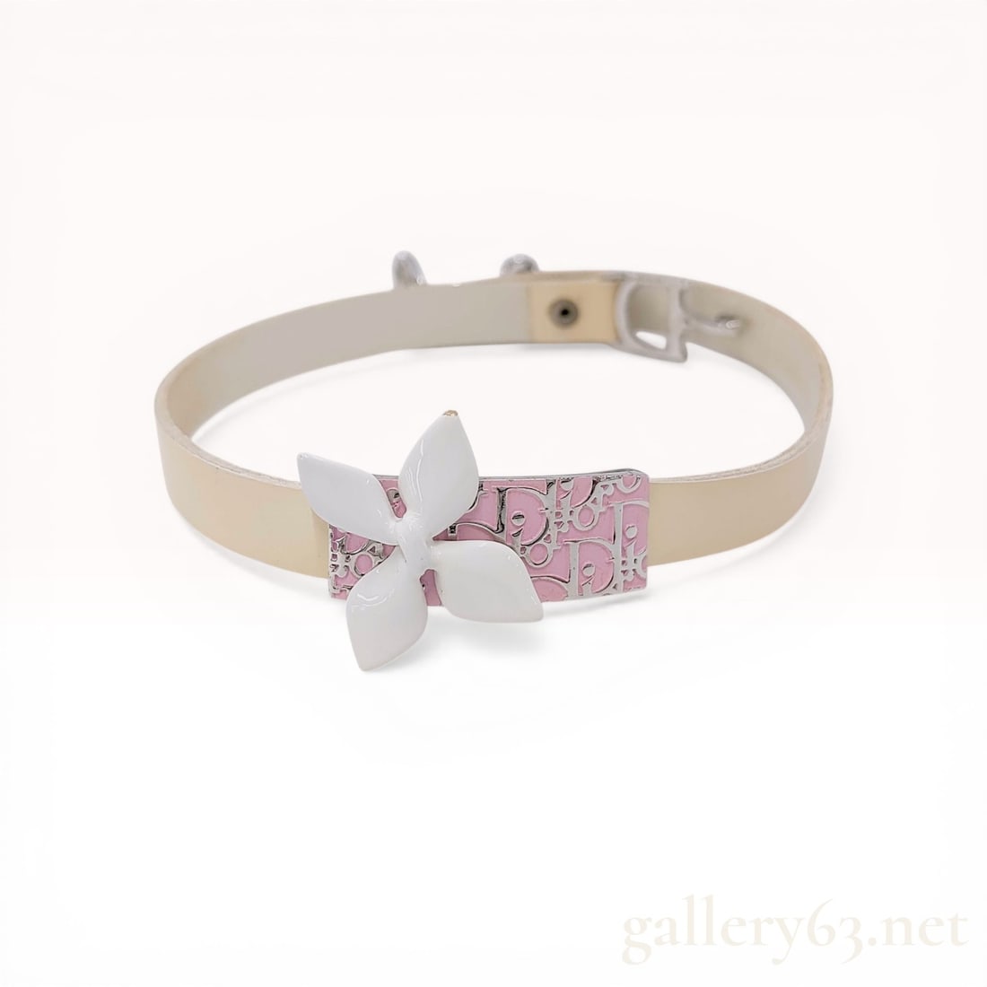 Christian Dior Pink Trotter Girly Flower Choker Necklace: Christian Dior Girly collection choker necklace, circa 2004. The design features an off-white leather strap with a central silver-tone plaque showcasing a pink Diorissimo monogram pattern topped with 