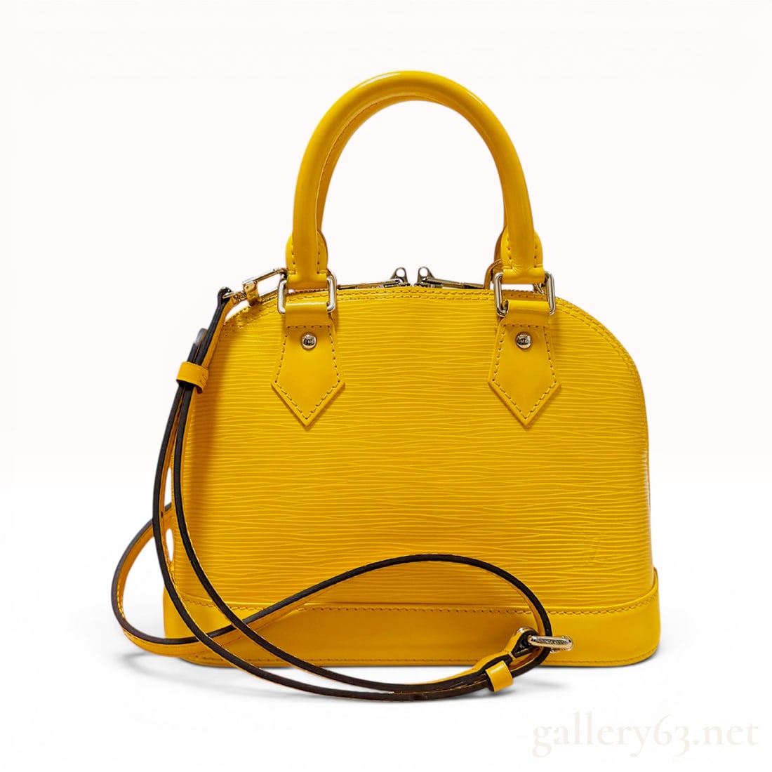 Louis Vuitton Epi Alma BB M40866 Citron 2-Way Handbag: This Louis Vuitton Alma BB handbag is crafted from yellow Citron Epi leather, a durable textured calfskin with a signature horizontal grain. The bag features a structured dome shape and is accented wi