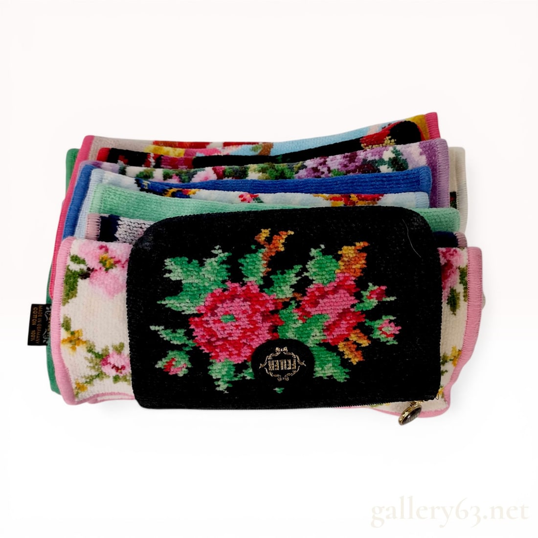 A Collection of Feiler Chenille Floral Pouch and Hand Towels: A collection of Feiler floral-patterned accessories, late 20th to early 21st century. The lot includes one zippered pouch with a gold-tone logo pull and several small towels or handkerchiefs featuring