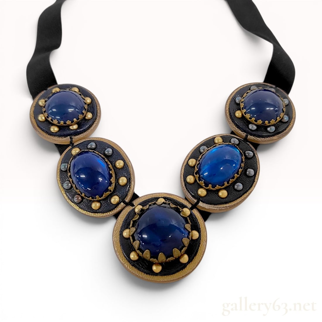 Miu Miu Blue Cabochon and Faux Pearl Leather Bib Collar Necklace: A designer bib-style collar necklace from the Italian fashion house Miu Miu. The necklace features five articulated medallions composed of large central blue cabochons, likely made of poured glass or 