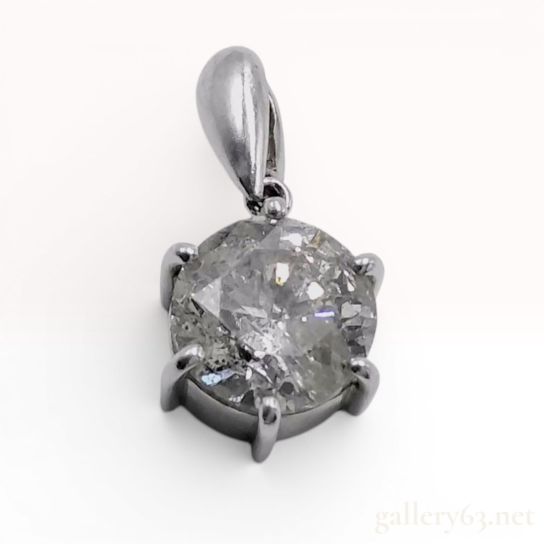 2.011 Carat Natural Diamond and PT850 Platinum Solitaire Pendant: A solitaire gemstone pendant featuring a single round brilliant cut natural diamond. The diamond is secured in a six-prong basket setting and suspended from a tapered fixed bail. The interior surface