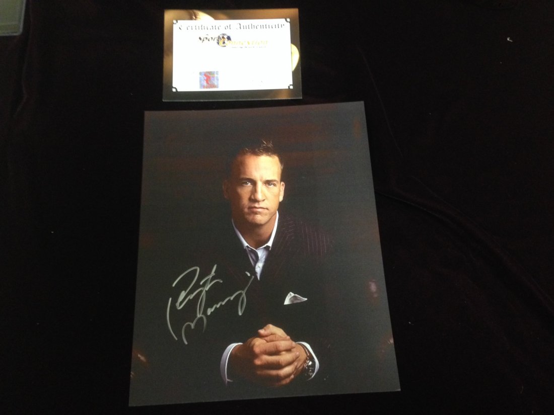 Peyton Manning autographed portrait photo: Peyton Manning signed portrait photo with COA.
