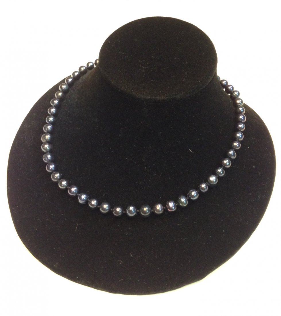 Tahitian Pearl Necklace: Graduated strand of black Tahitian pearls ?mm.