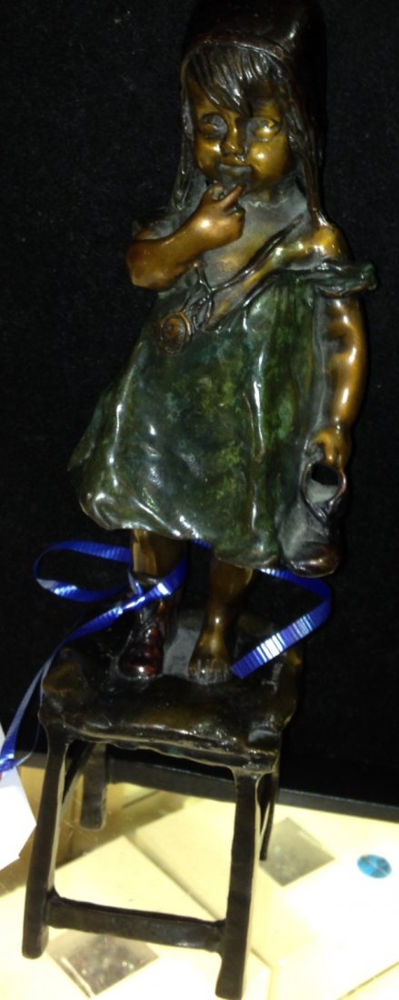 Bronze Statue of a Girl on a Chair Signed Juan Clara: Rare and Important artist signed Juan Clara bronze statue depicting a girl with a boot standing on a chair. Measures 12" tall.