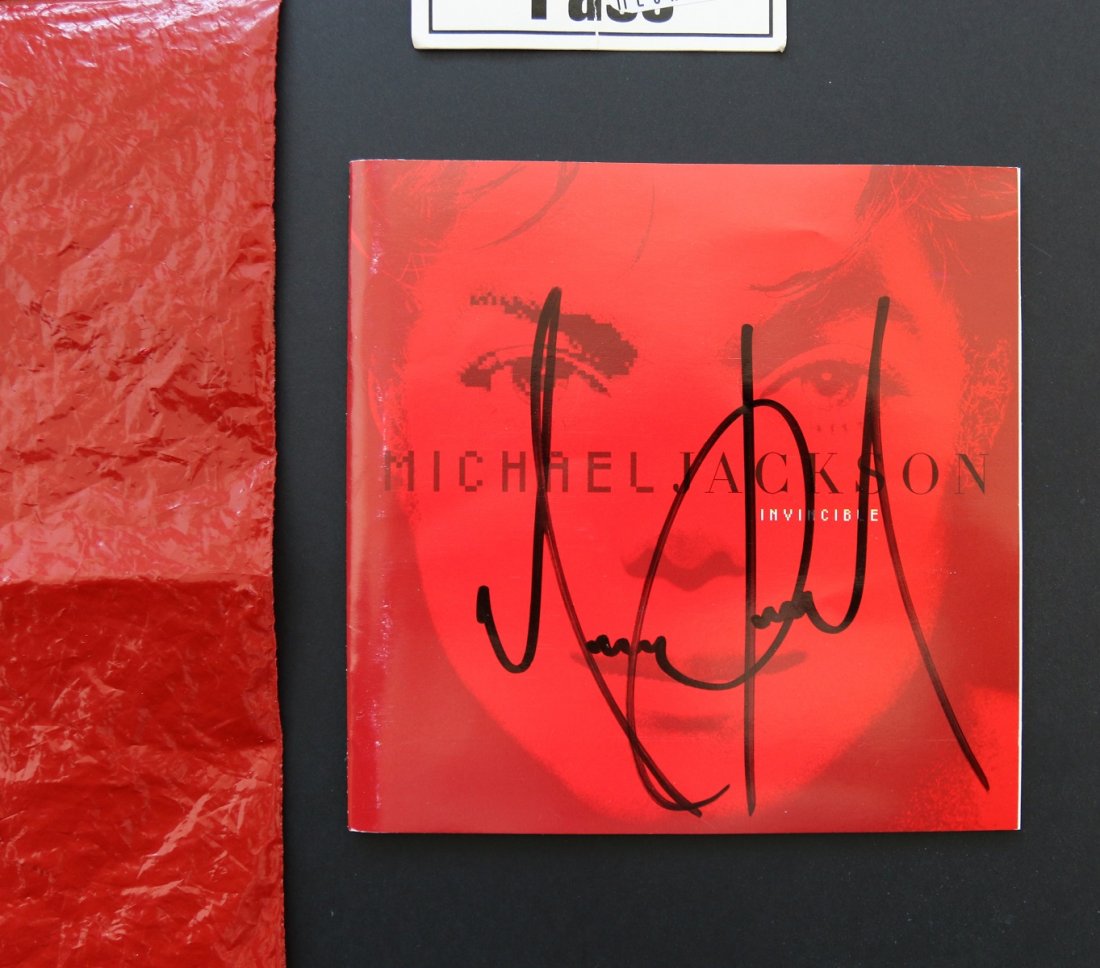 Michael Jackson Signed Invincible CD with Pass (1 of 3)