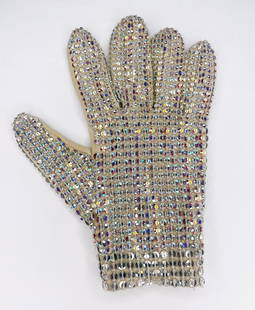 Michael Jackson Stage Worn Glove: Knaisz Auctions & KnaiszLive auction: This is a custom-designed, white cotton right-hand glove, the back side of the glove is completely covered in clear Swarovski loch rosen crystals and the palm is