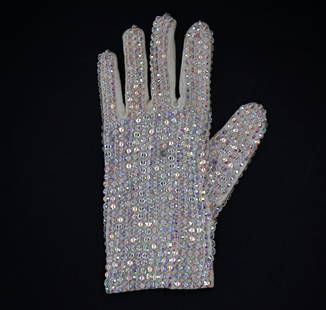 Michael Jackson's own Thriller party invitation glove from 1984: KnaiszAuctions.com & KnaiszLive.Com Present: A single white left-hand crystal glove owned and worn by Michael Jackson with message on the palm reading, "Walter Yetnikoff Don Dempsey Allen Davis invite