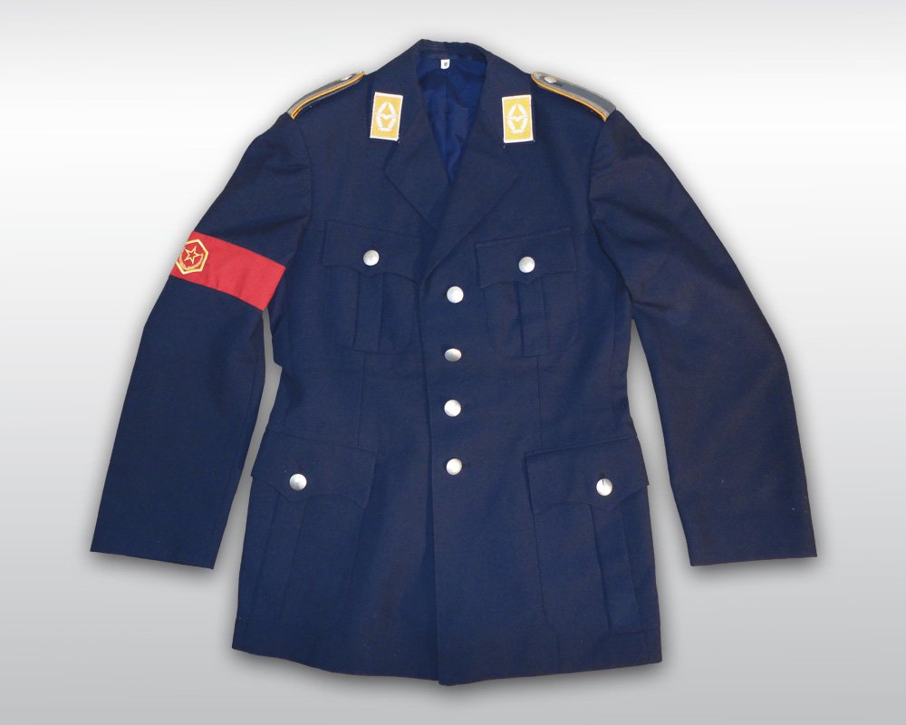 MICHAEL JACKSON WORN MILITARY JACKET: Michael Jackson owned and worn military style jacket. A costume made dark blue military jacket from the '90s. The jacket also features Jackson's signature armband in red silk with yellow embroidered s