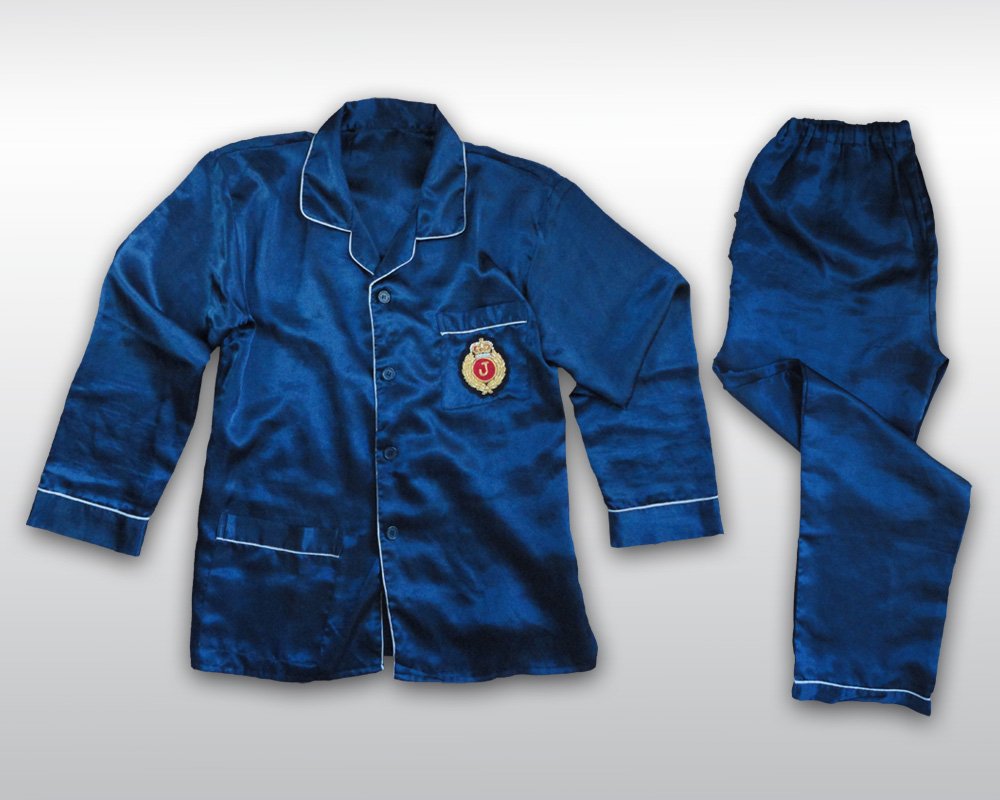MICHAEL JACKSON OWNED AND WORN PYJAMAS: Michael Jackson owned and worn pyjama shirt and pants from his HIStory Tour era. This is a dark blue silk pyjama customized with a „J” patch on the left chest. J means 'Jackson'. Interior Dennis T